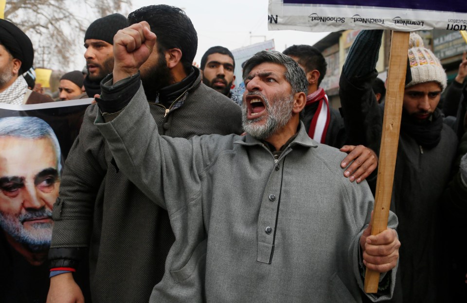  Pictures of Soleimani and placards were carried by the angry mob