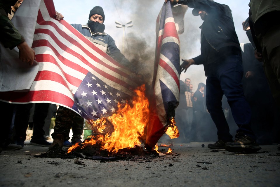 Locals in Tehran display horrific scenes of outrage as they burn American and British flags