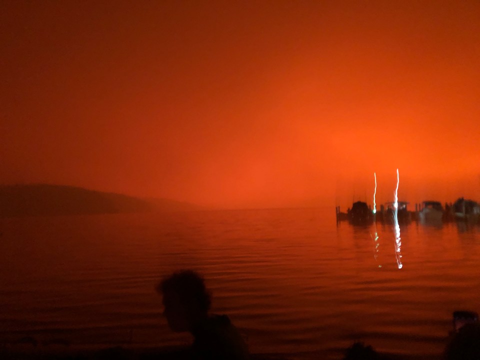  The skies turned red over those waiting to be rescued by the Navy as the fire approaches the bay near Mallacoota