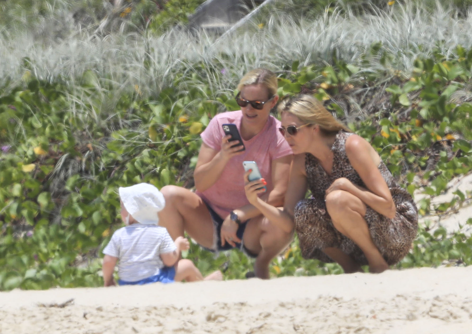 The Queen's grand-daughter stayed on the sand with her youngest child