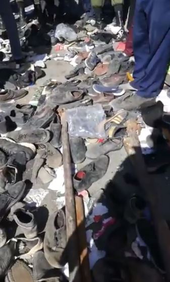  Chilling images show piles of shoes littering the ground