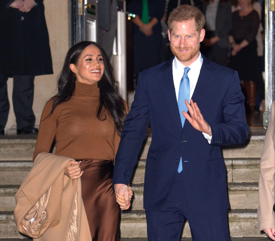  Harry and Meghan all smiles as they leave Canada House