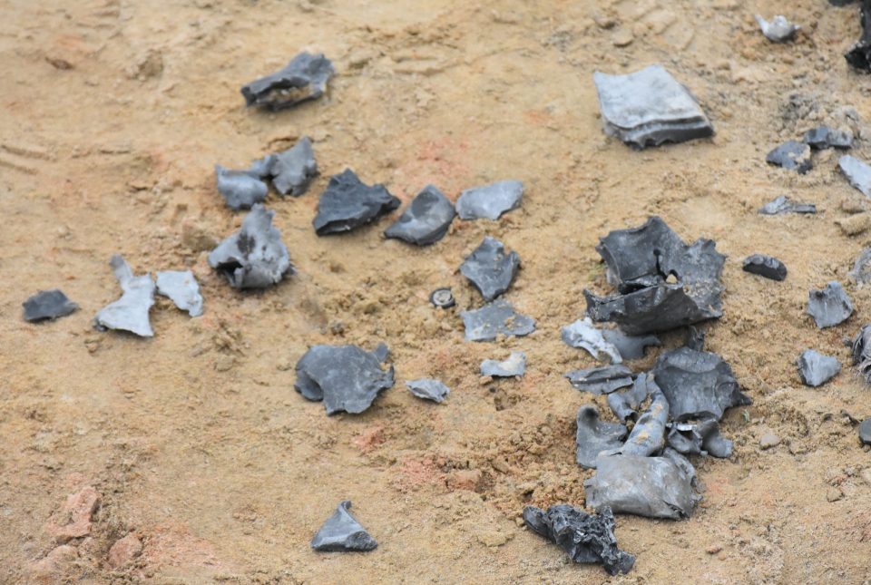  Shell fragments lie on the ground after the missile barrage