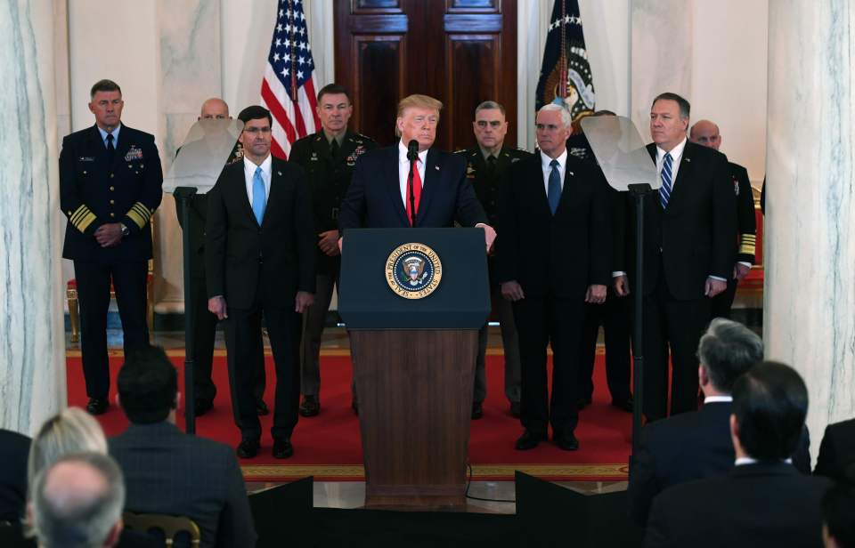 US President Donald Trump(C) speaks about the situation with Iran in the Grand Foyer of the White House