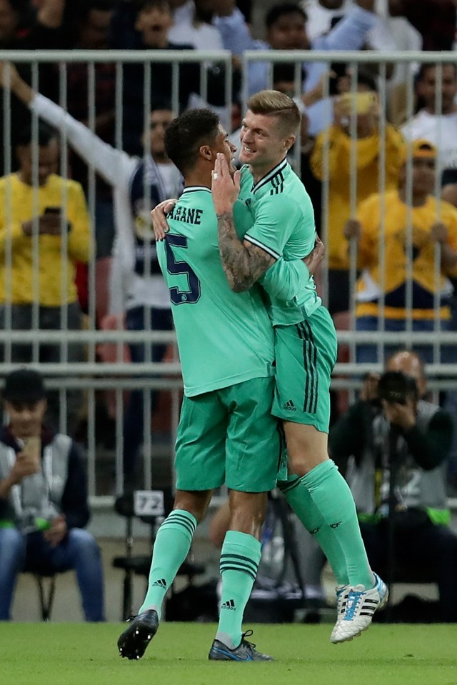  Toni Kroos is heralded by his team-mates after the wonder goal