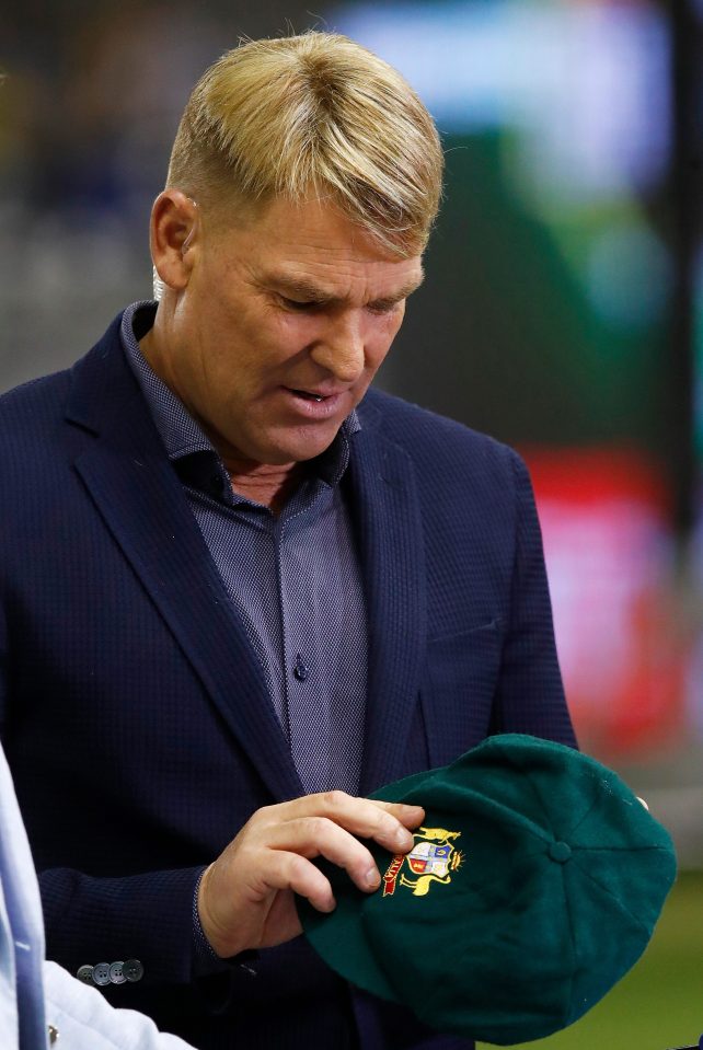  Shane warn pictured holding his baggy green, an iconic symbol of Australian Test cricket