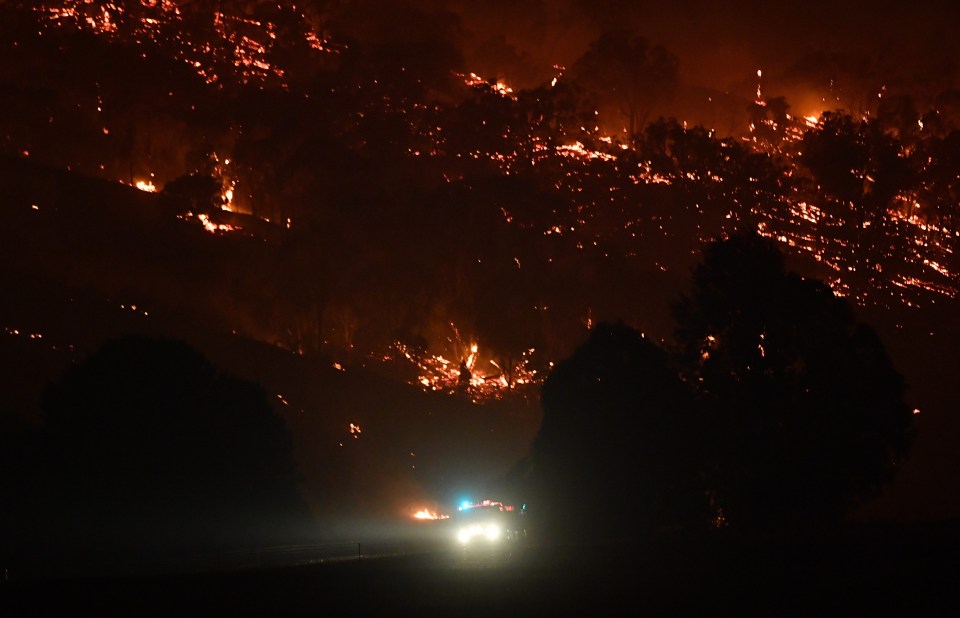 Rural Fire Service firefighters conduct property protection patrols at the Dunn Road fire around Mount Adrah earlier this week