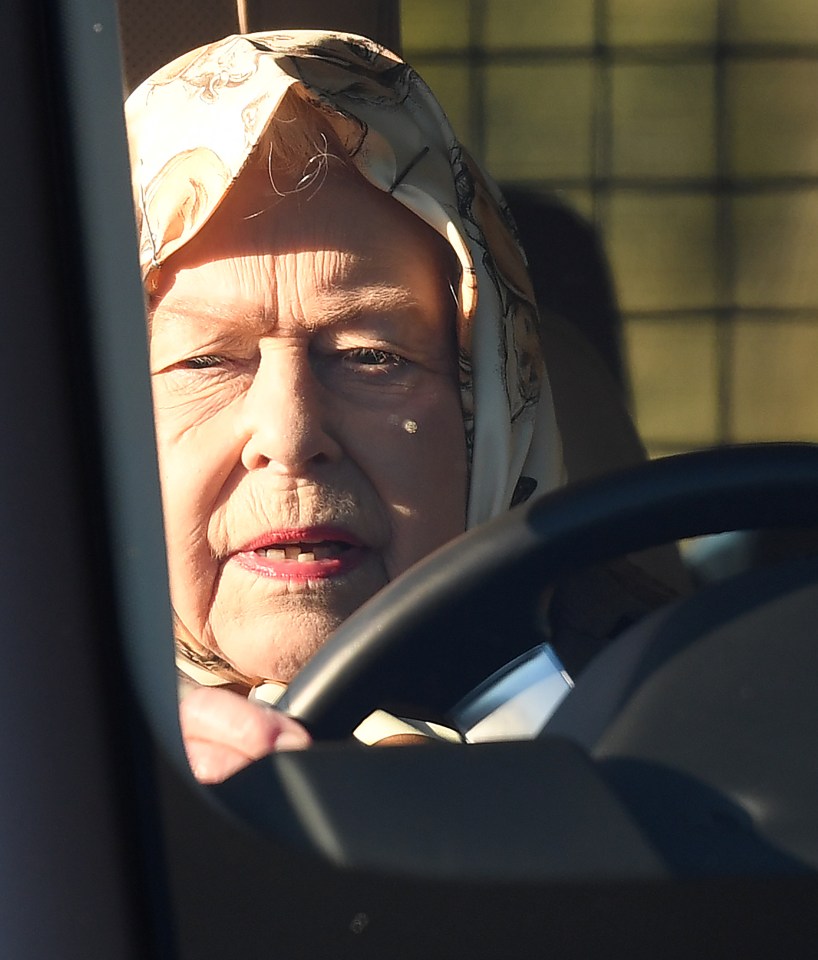  The Queen did not look amused as she drove around the Norfolk estate