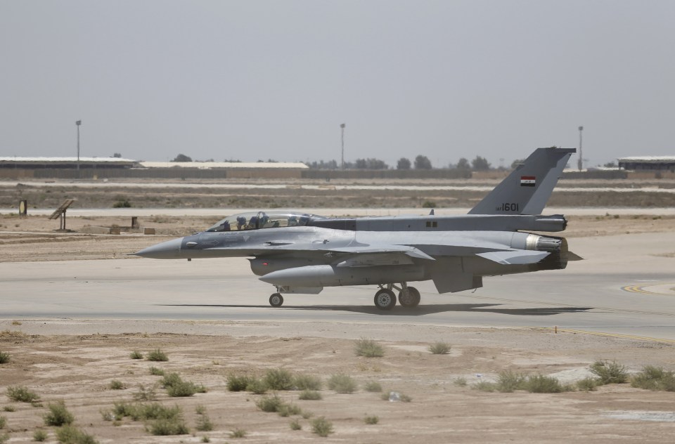  A US F-16 fighter jet on the tarmac if a military base in Balad, Iraq