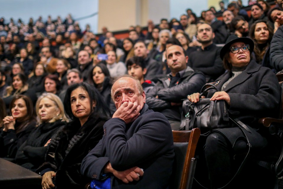 Mourners at a vigil for Canadian victims of the crash in Toronto