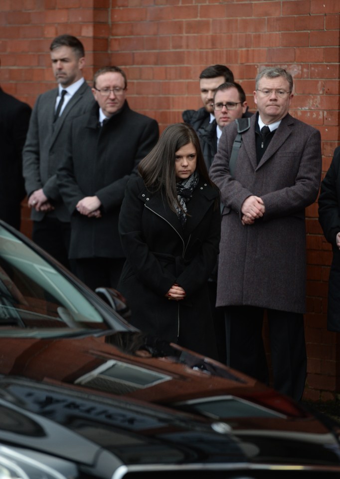  Mourners watch the cortege pass through Glasgow today