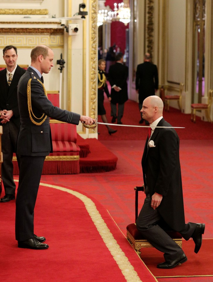 William showed his brother how it is done with an investiture at Buckingham Palace today – pictured here knighting former England cricket captain Andrew Strauss