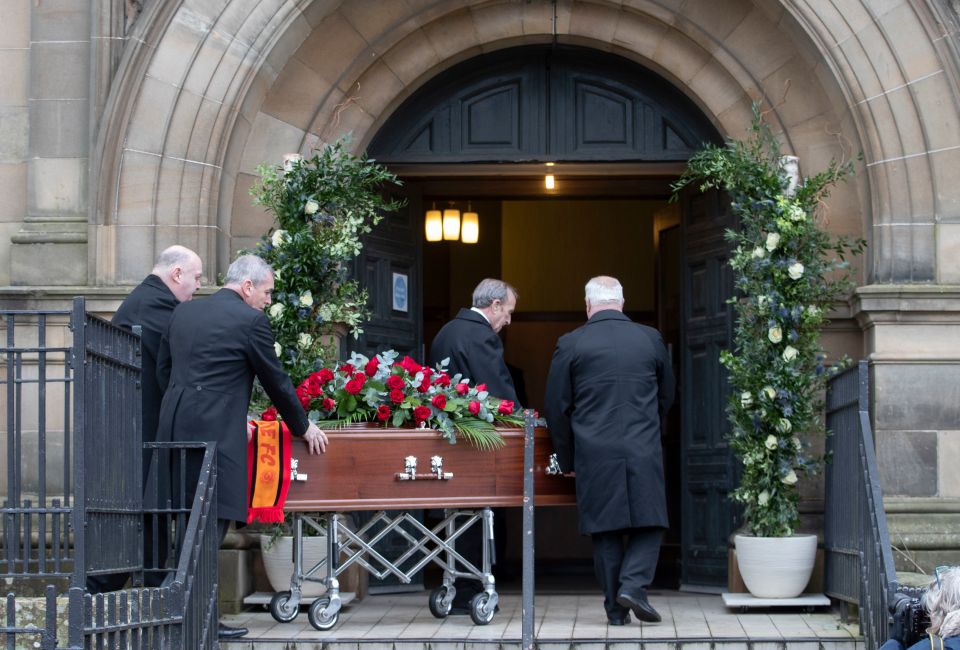  His coffin is taken into the service