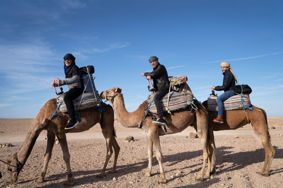  The trio riding camels