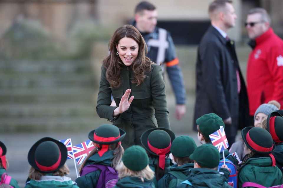  Kate seemed overjoyed to see the youngsters waving flags as they lined up to meet her