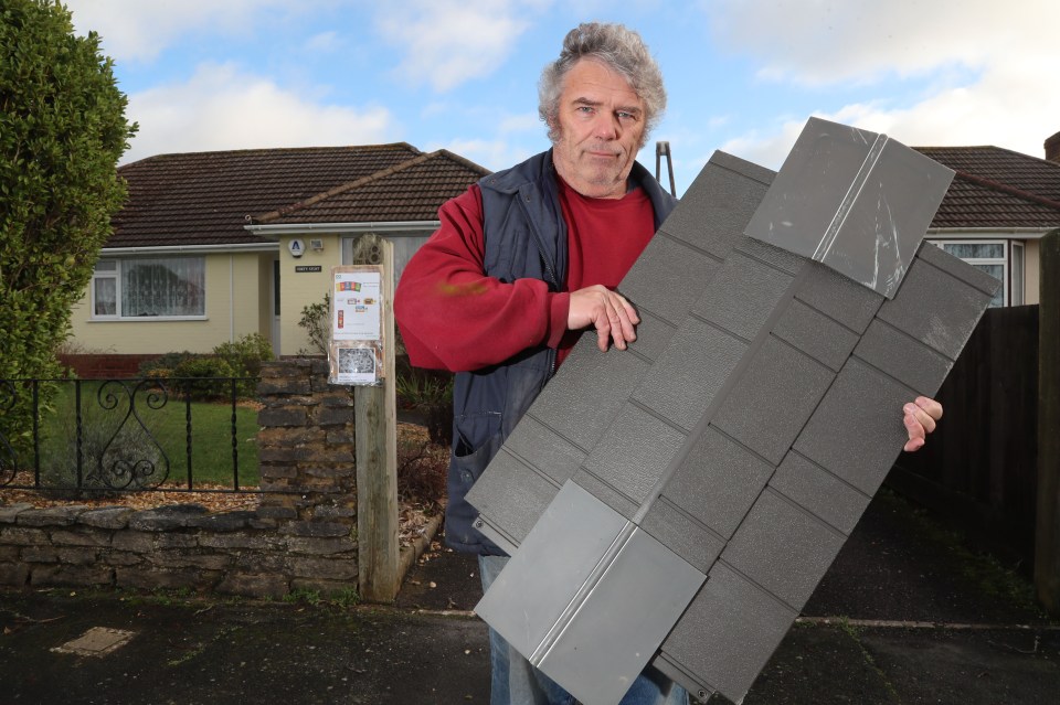  Mike Bird with piece of someone's shed roof which ended up hitting his car