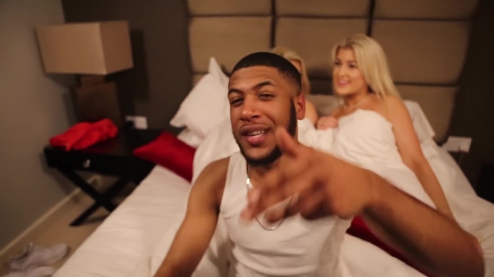  They went topless in bed while the rapper performed for the camera