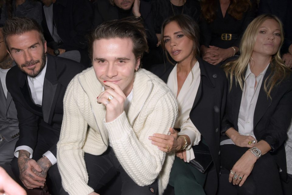  Brooklyn smiles as paparazzi spot the Beckhams front row with Kate Moss