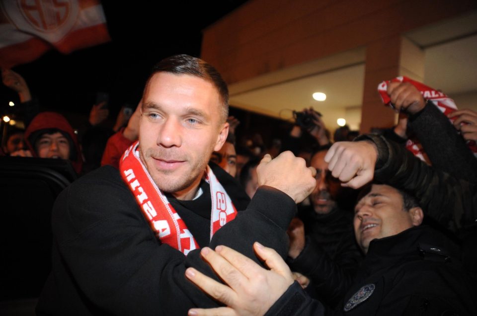  Lukas Podolski was mobbed as he touched down in Turkey to sign for Antalyaspor