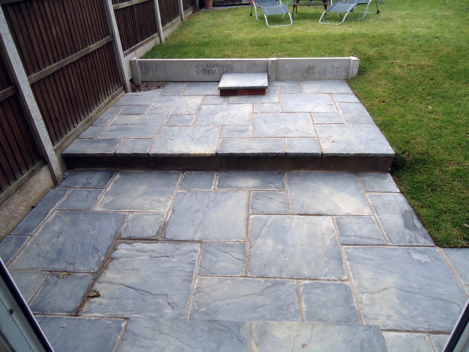  Sue laid down paving after flowers would not grow in her backgarden