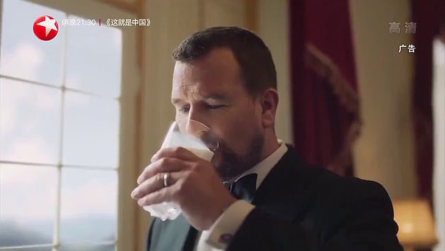  Phillips takes a swig of milk in the lucrative advert