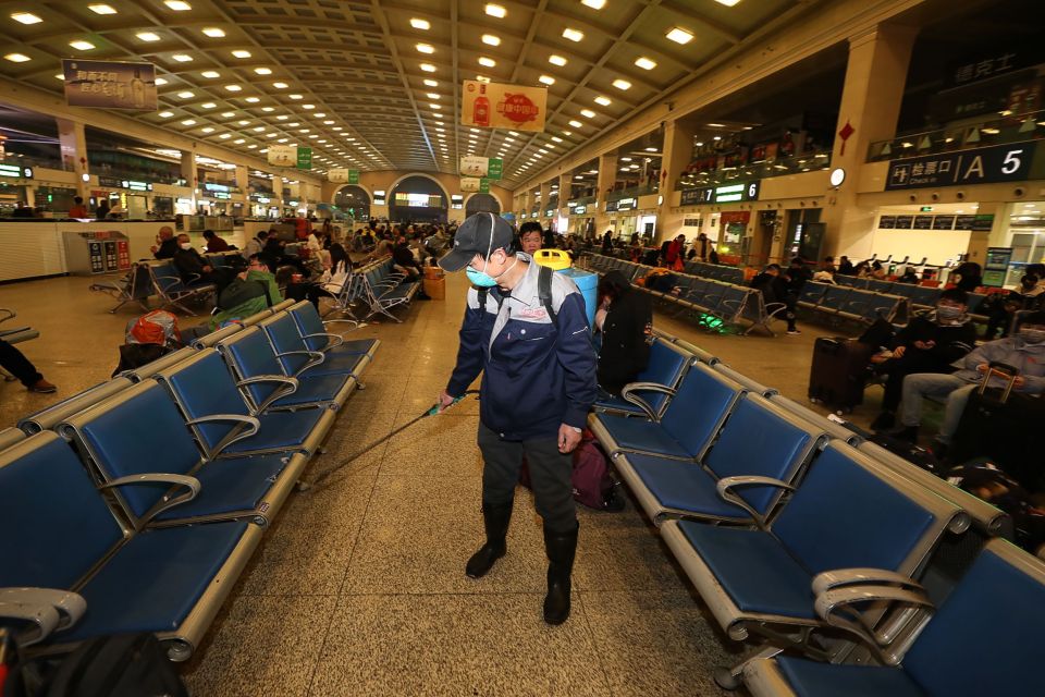  A staff member disinfects the Hankou Railway Station in Wuhan on Wednesday morning