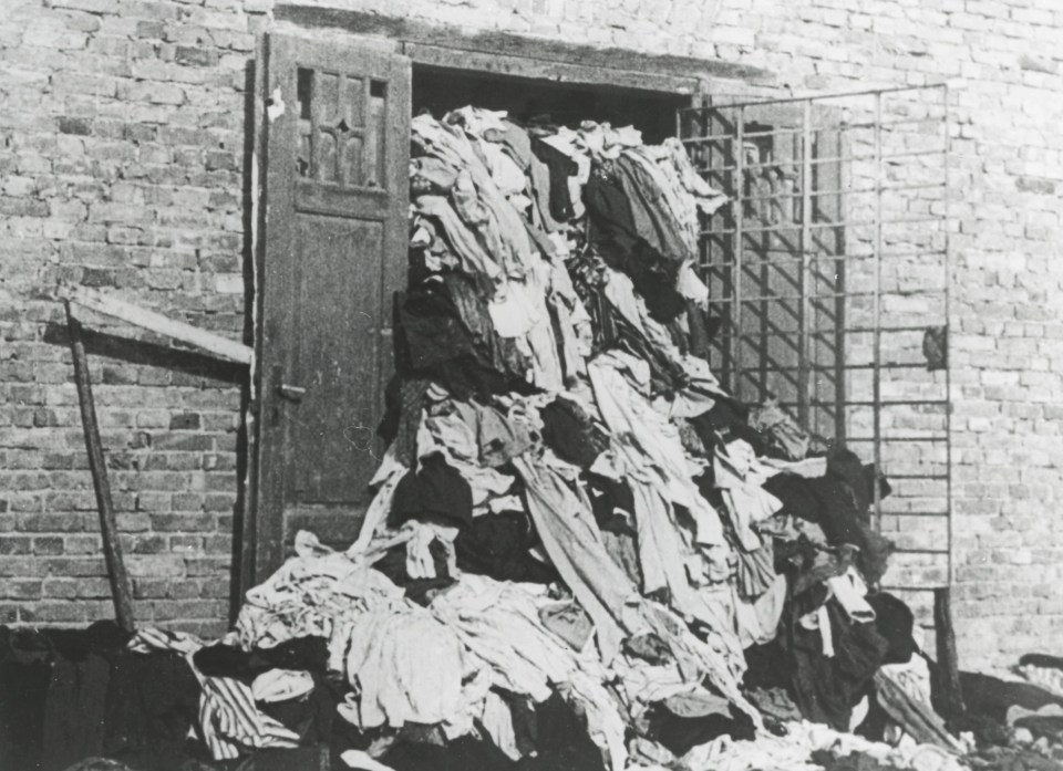  A picture shows piles of clothes that belonged to people brought to Auschwitz