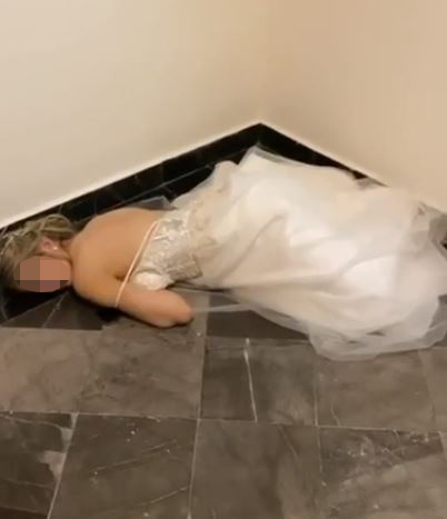 A bride was forced to spend her wedding night in the corridor after losing her hotel room key card