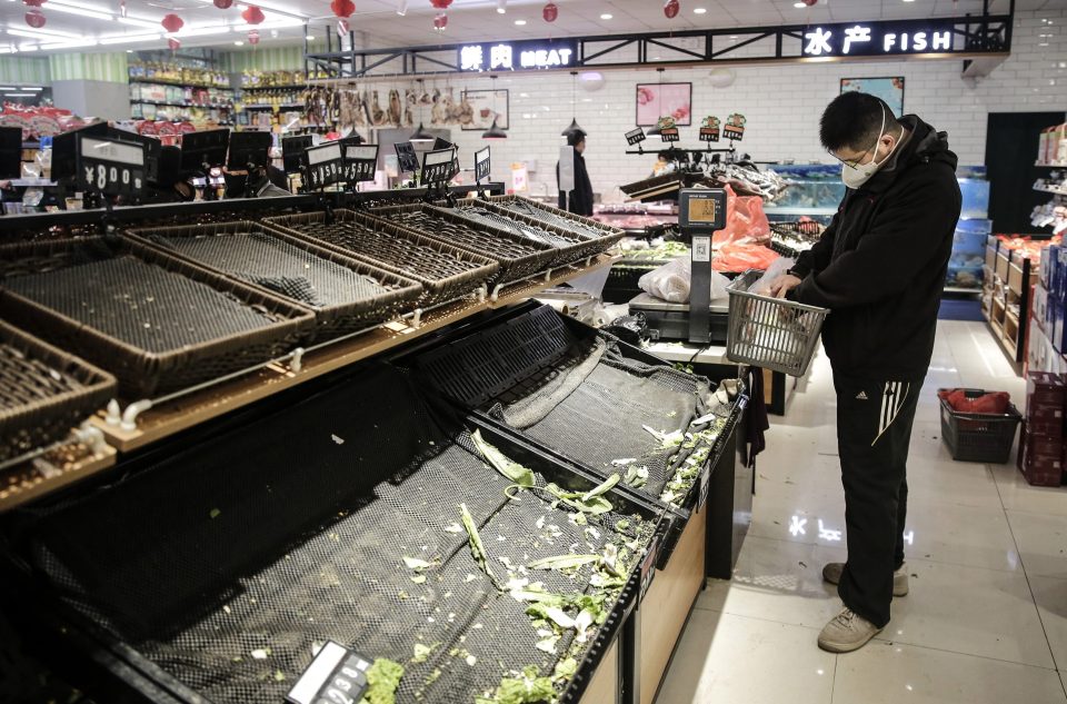 Supermarket shelves in Wuhan are bare as residents scramble to stockpile on goods