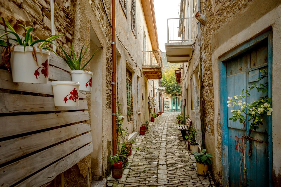  Narrow cobbled streets in Lefkara house buildings all made from the same white and silica limestone