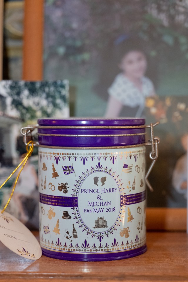  A purple commemorative sweet tin sits on Thomas's mantel to mark the royal wedding that he could not attend