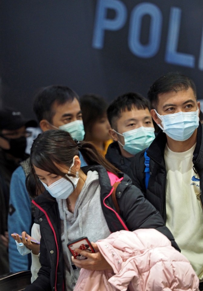  People wearing face masks at a metro station in Taipei, Taiwan