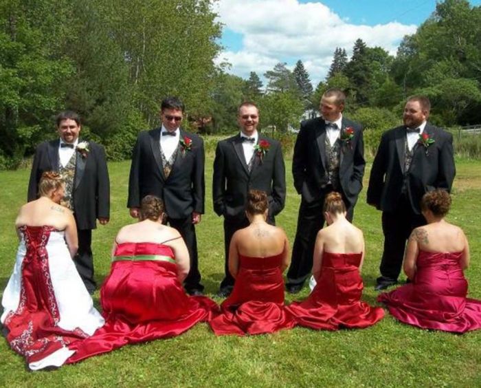 A wedding party has been slammed for this "trashy" snap that saw them pretending to perform a sex act