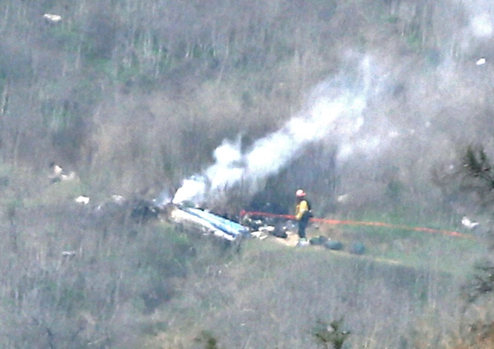 The remains of the helicopter can be seen in this picture