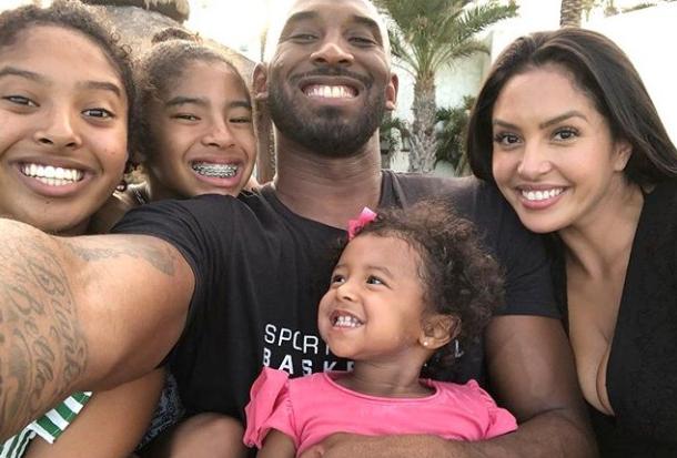  The basketball legend with wife Vanessa and his daughters