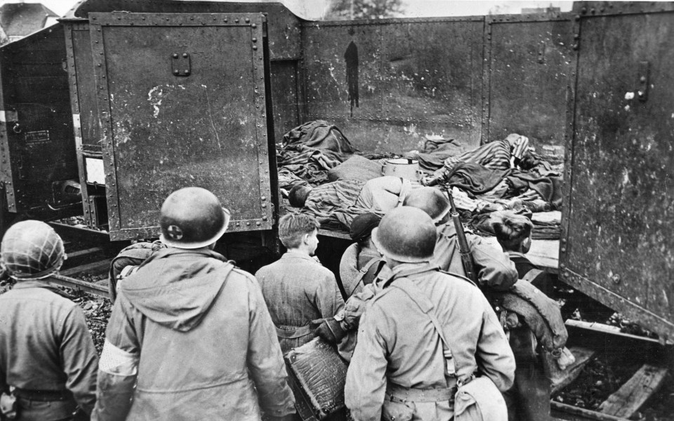  Russian soldiers view bodies of those left on train carriages. Most dead on arrival