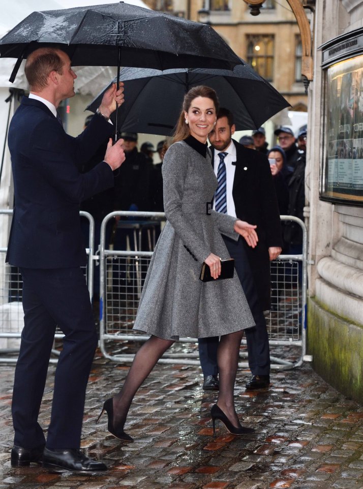  She smiled at her husband William, who held an umbrella in the rain