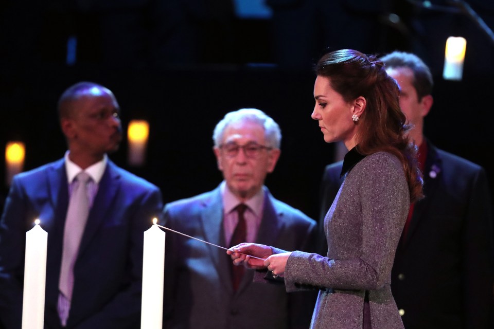  The Duchess honoured victims by lighting a candle during the ceremony