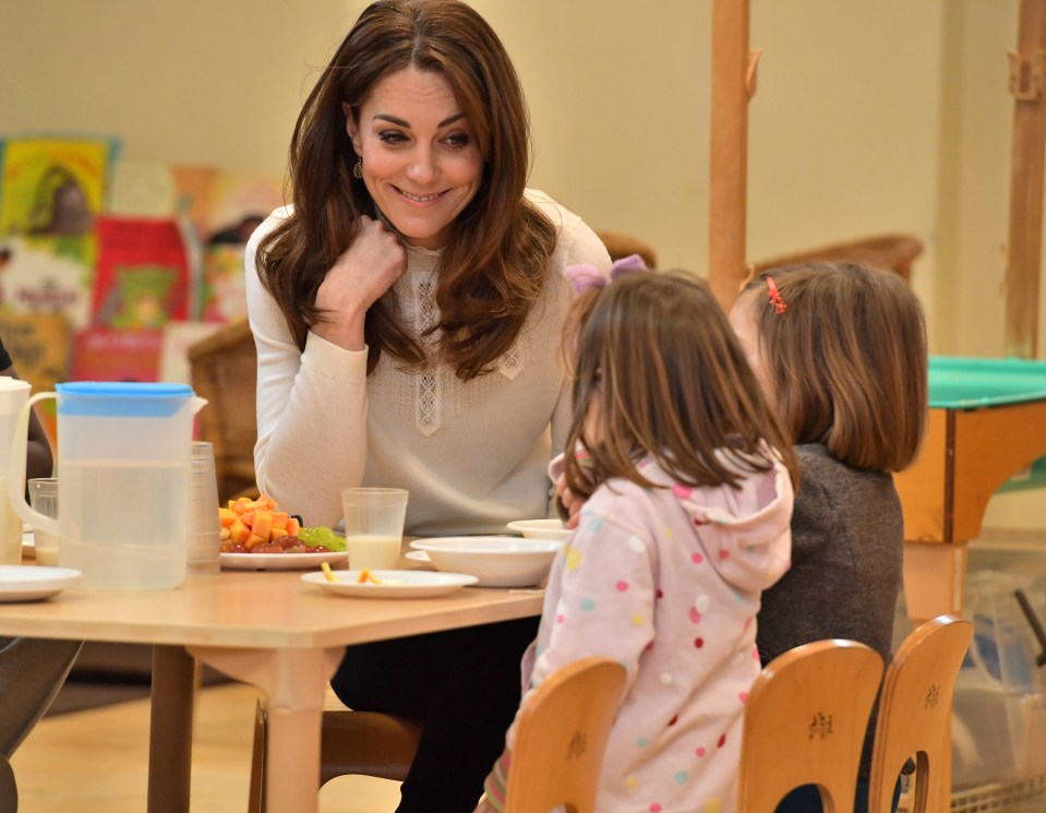  Kate Middleton plays with some of the students at Stockwell Gardens Nursery and Pre-School