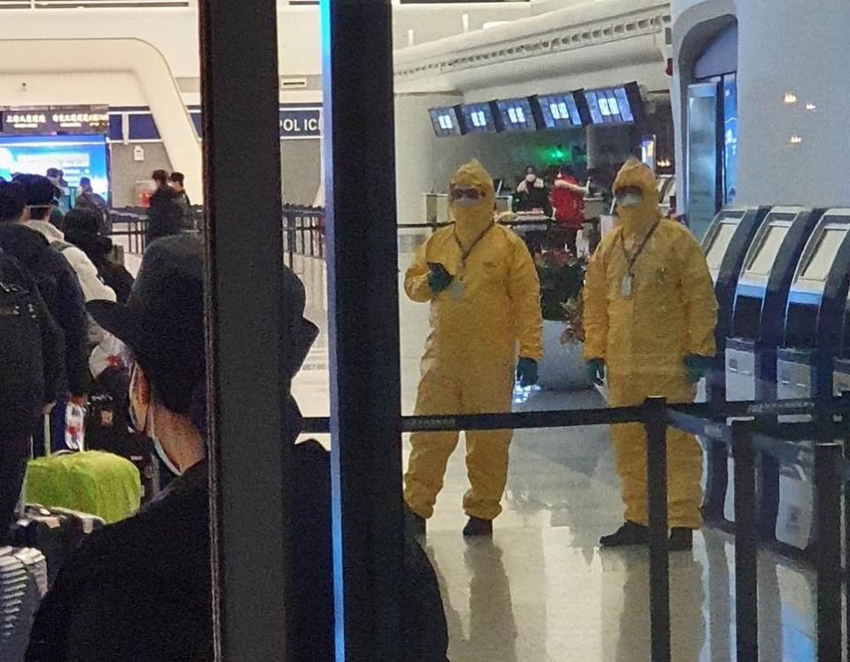  Medics in Hazmat suits at Wuhan airport