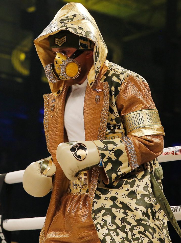  Jake Paul entered the ring in a sparkling gas mask