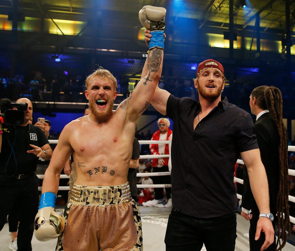  Jake Paul celebrates with his older brother Logan following his first round stoppage