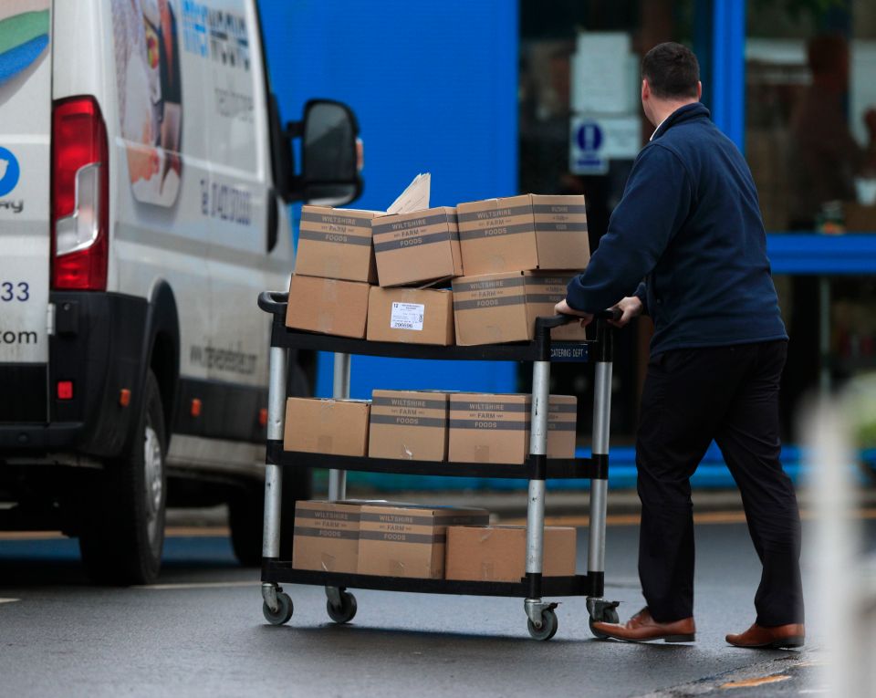  Food packages are pushed into Arrowe Park Hospital on a trolley