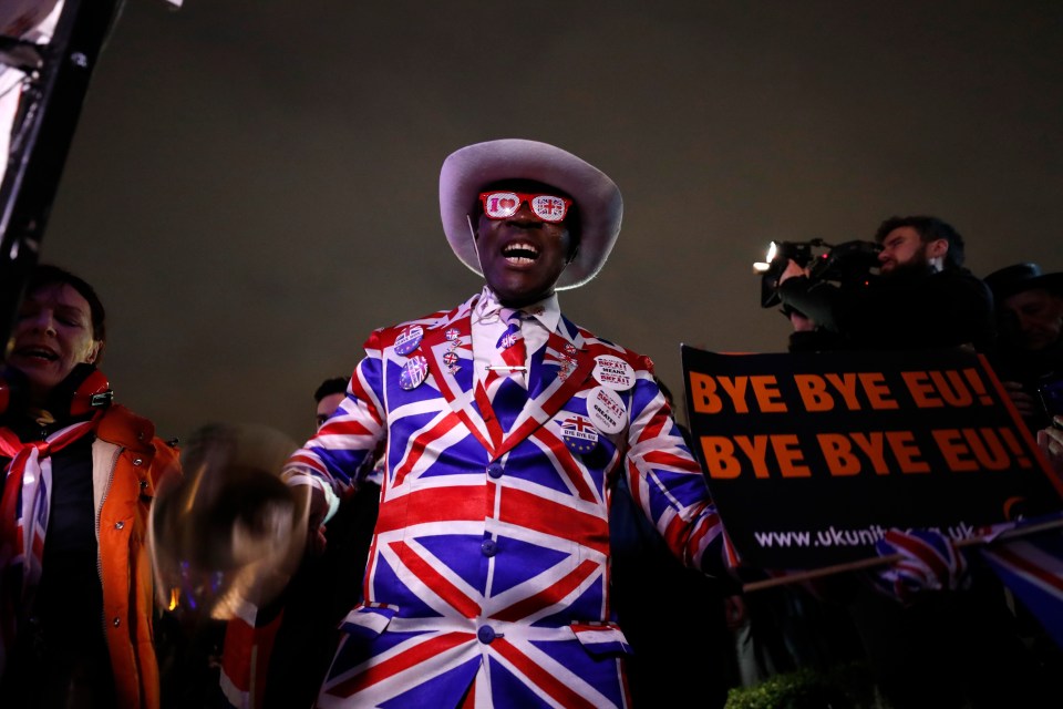 A Brexit supporter takes part in a rally at the Parliament square in London