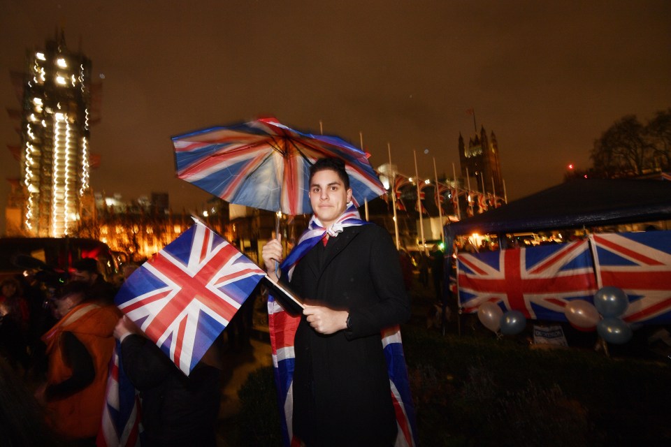  A pro-Brexit supporter celebrating in Parliament tonight as Britain leaves the EU