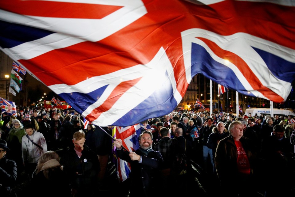  A man waves a British flag to mark Brexit