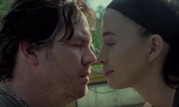  Rosita appears to kiss Eugene farewell in the latest teaser clip