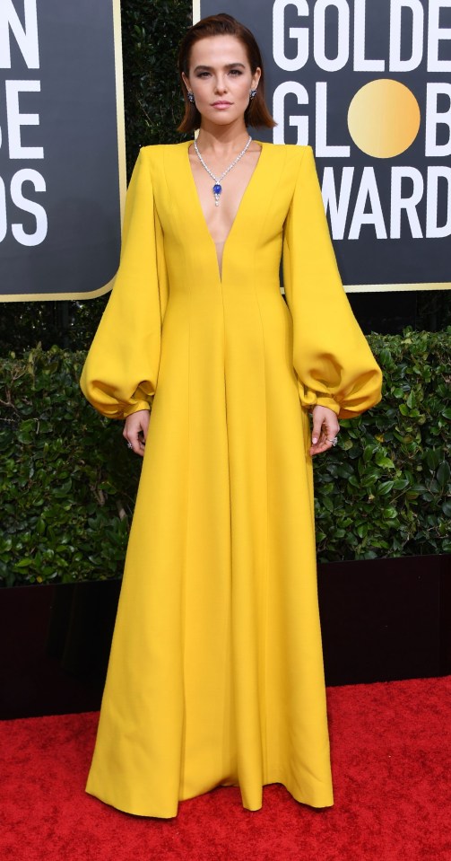 The Politician actress Zoey Deutch opted for a show-stopping yellow dress with statement sleeves and plunging neckline