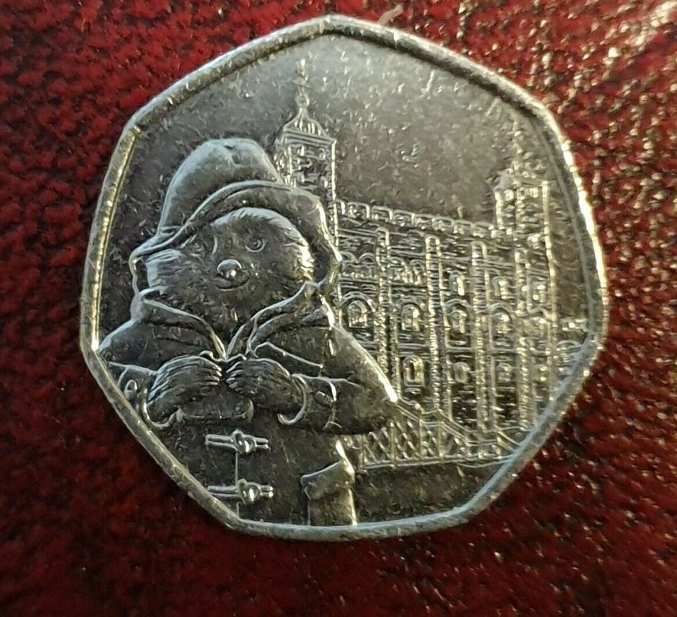  The design features Paddington Bear standing outside the Tower of London