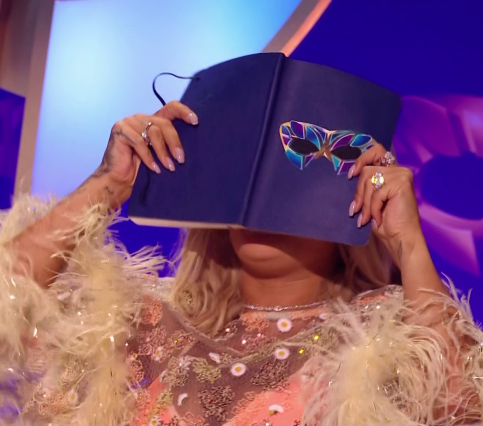 Rita hid her face with embarrassment